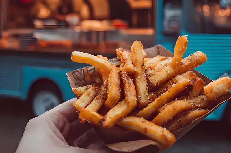 French fries in front of a food truck
