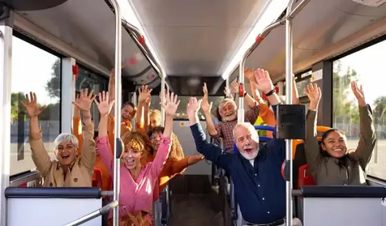 excited group on tour bus